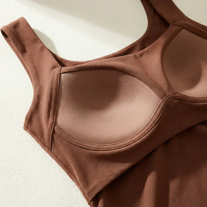 Activewear women's tank top with built-in bra, great for workouts and daily support.