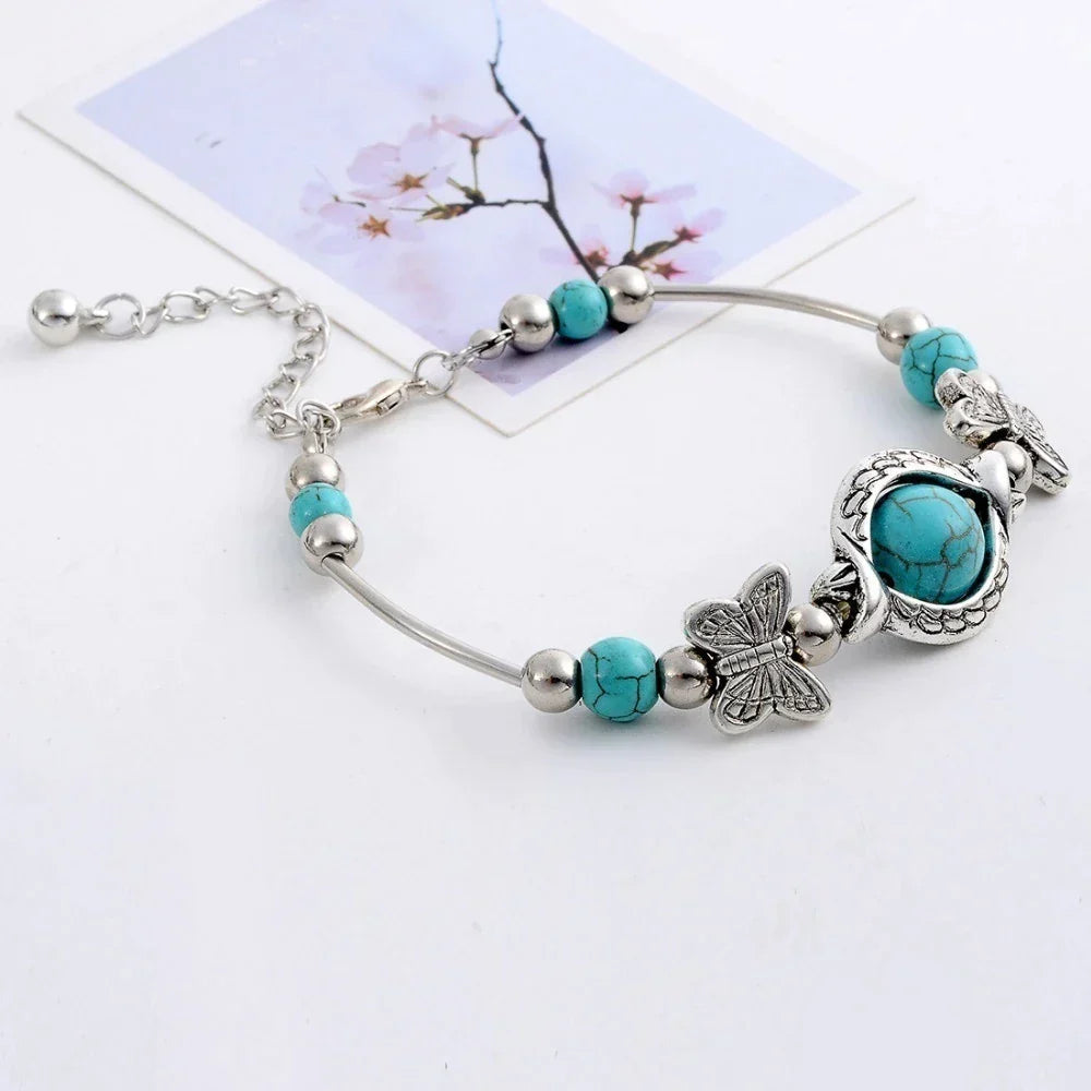 Adjustable women's turquoise & butterfly beaded bracelet, a perfect gift and stylish jewelry piece.