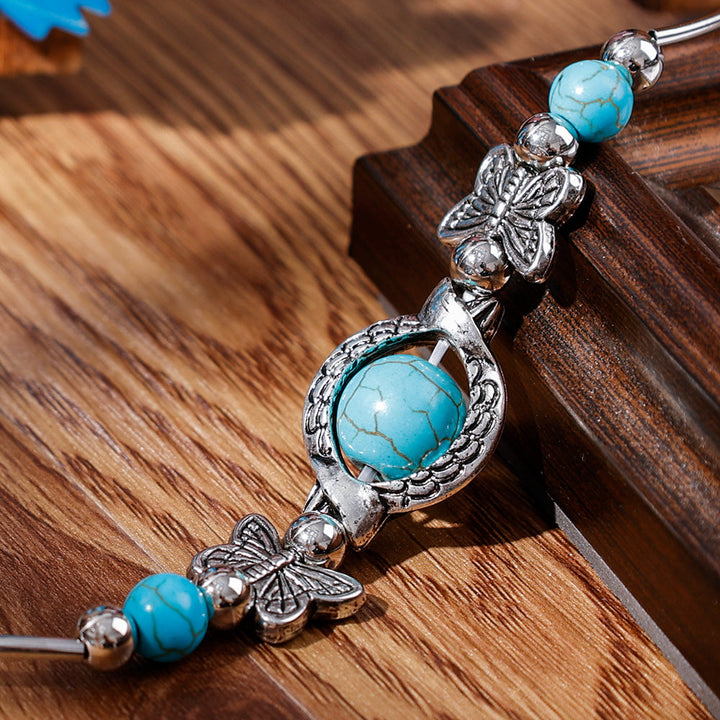 Elegant women's silver & turquoise beaded butterfly bracelet, a beautiful and adjustable jewelry accessory.