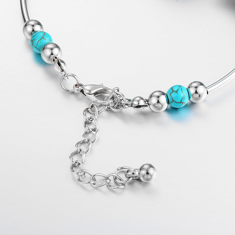 Gorgeous women's beaded bracelet with turquoise stones and silver butterfly charms, a lovely adjustable gift.