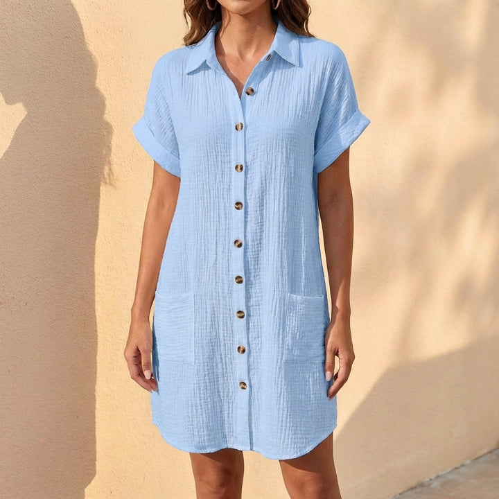 Comfortable women's button-front midi shirt dress, cuffed sleeves. Relaxed fit ideal for summer style.