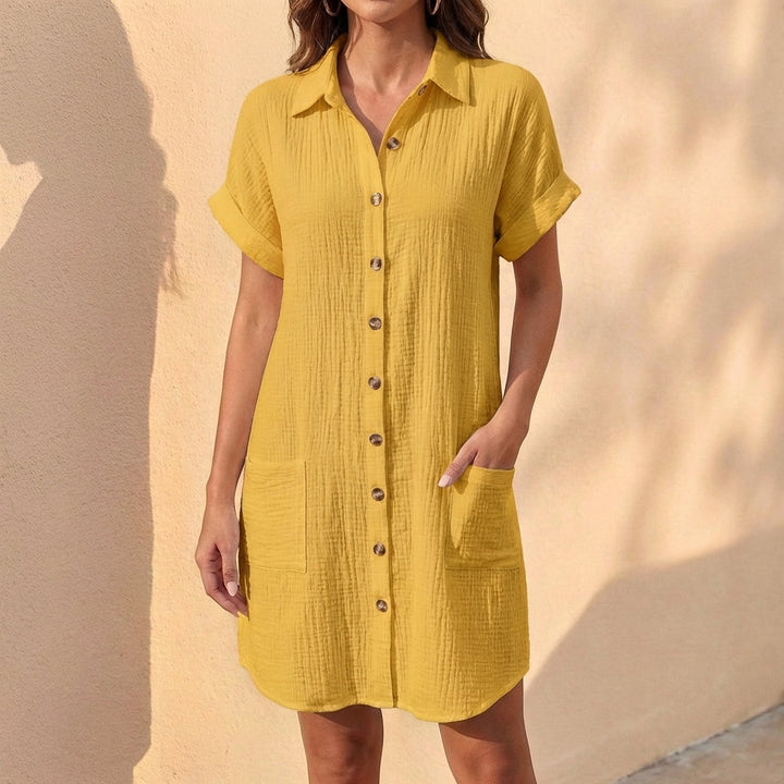 Elegant women's button-front midi shirt dress with cuffed sleeves. A comfortable and chic casual dress.