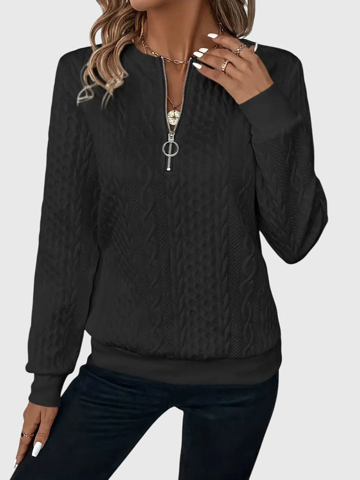Winter fashion women's cable knit quarter-zip sweater, providing warmth & chic style for cold days.