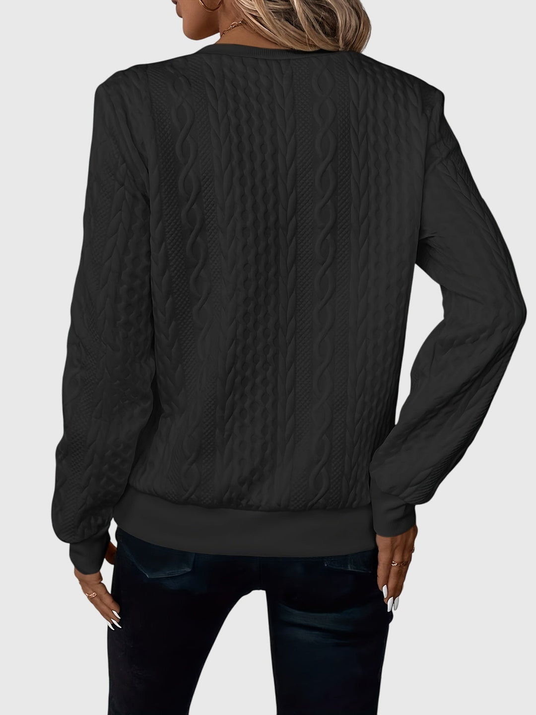 Long-sleeve women's cable knit quarter-zip, offering a cozy & stylish option for daily fashion.