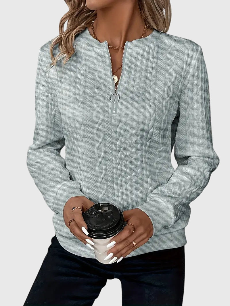 Chic athleisure women's cable knit quarter-zip sweater, blending comfort with modern style.