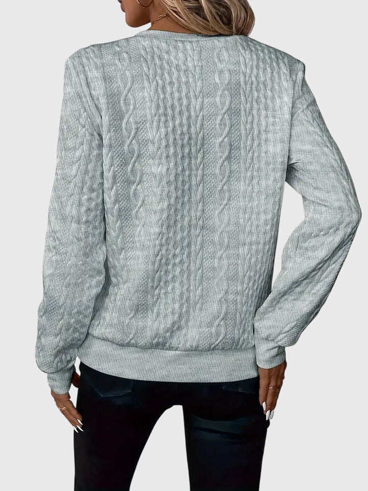 Versatile women's long-sleeve cable knit quarter-zip, great for elevated casual & cozy fashion.