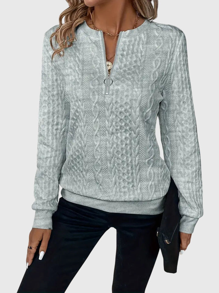 Everyday comfort: women's cable knit quarter-zip sweater, a stylish pullover for any occasion.