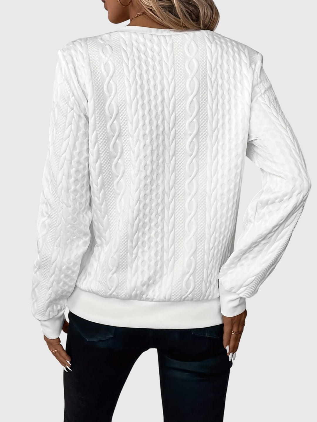 Stylish women's quarter-zip cable knit sweater, perfect for versatile athleisure and everyday wear.
