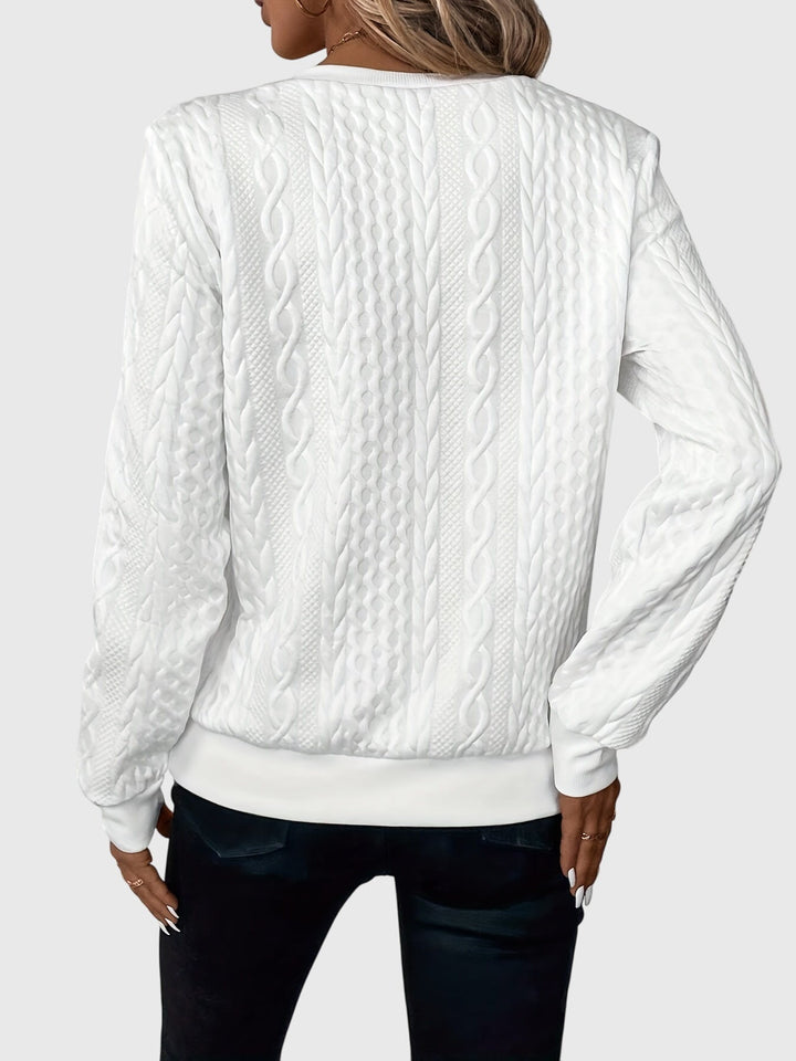 Stylish women's quarter-zip cable knit sweater, perfect for versatile athleisure and everyday wear.