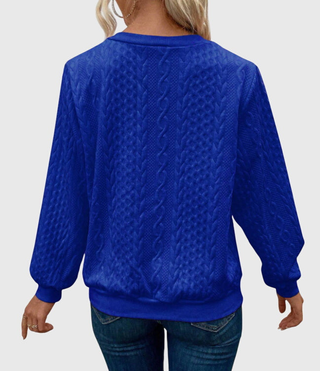 Women's fall fashion cable knit quarter-zip pullover, offering chic & comfortable everyday wear.