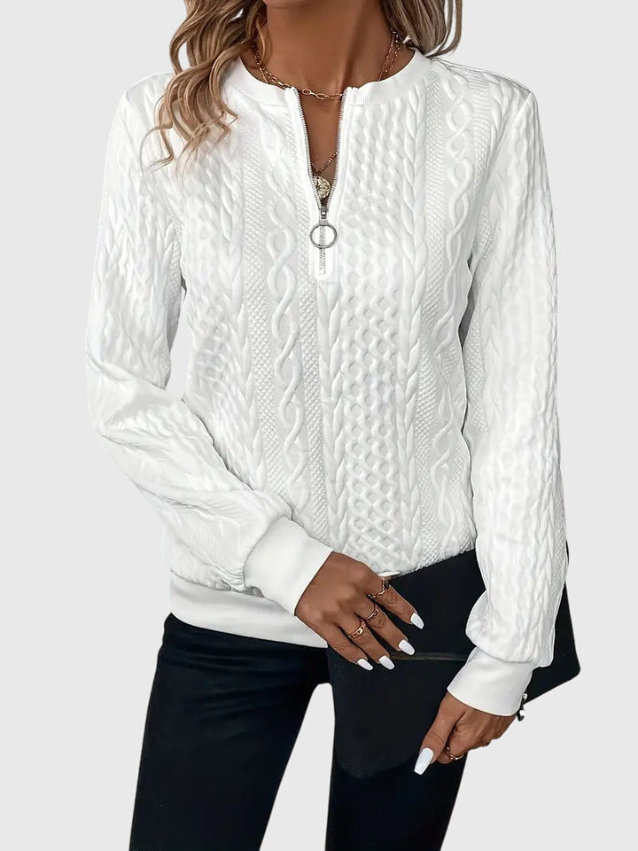 Versatile women's long-sleeve cable knit sweater with quarter-zip, ideal for casual fashion.