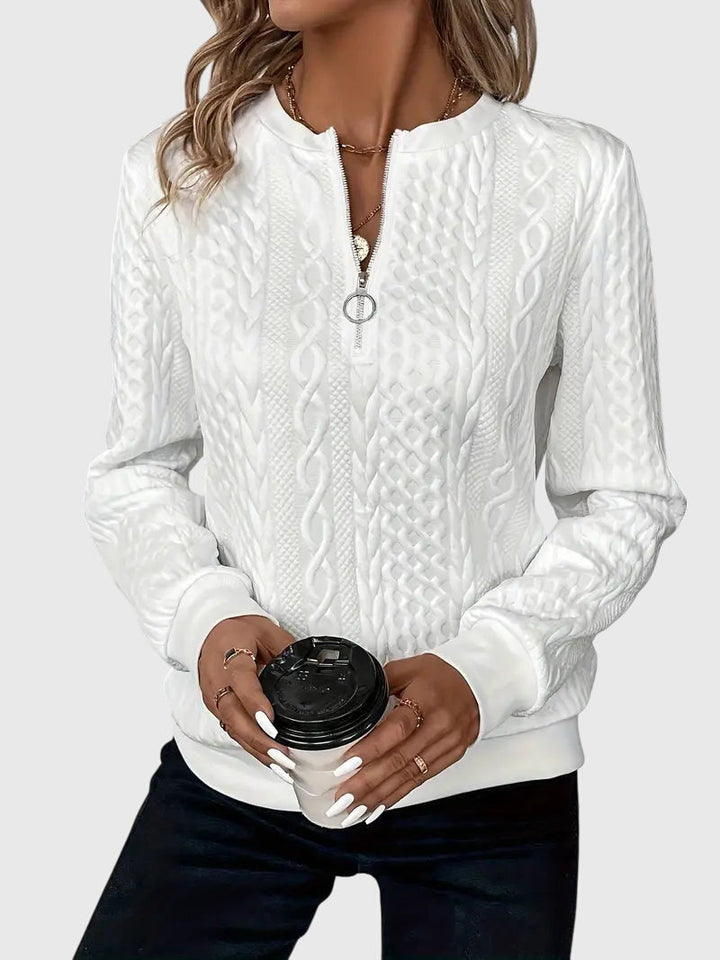 Cozy women's cable knit quarter-zip pullover, a warm and stylish option for cool weather.