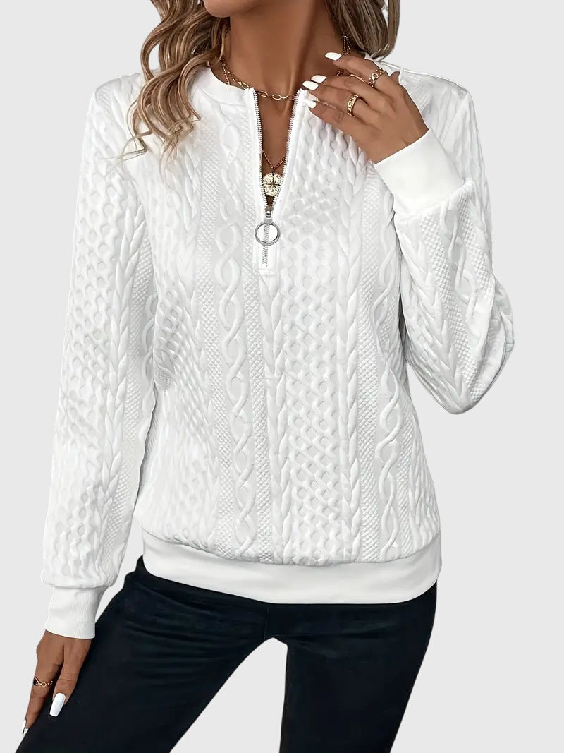 Elegant women's quarter-zip sweater, featuring a classic cable knit pattern for a sophisticated look.