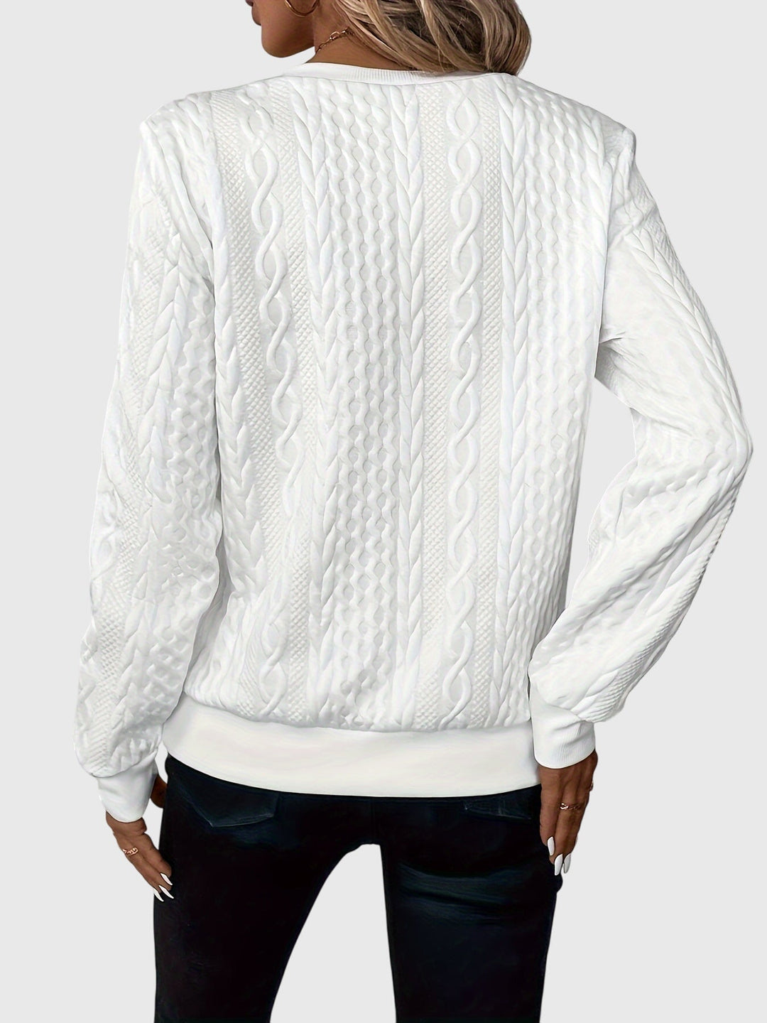 Warm women's long-sleeve cable knit pullover, designed with a quarter-zip for adjustable style.