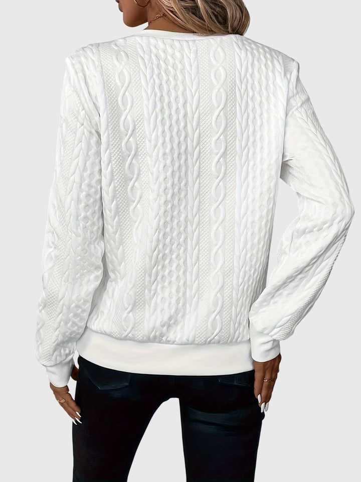 Warm women's long-sleeve cable knit pullover, designed with a quarter-zip for adjustable style.