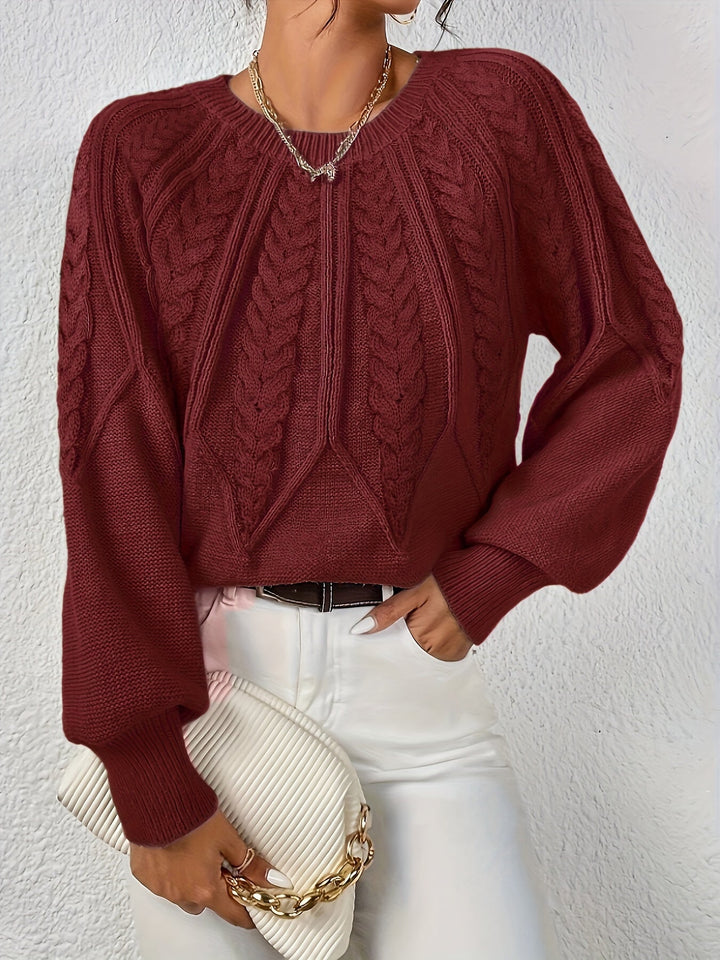 Stylish women's cable knit sweater, relaxed fit, fashionable lantern sleeves. Perfect fall style.