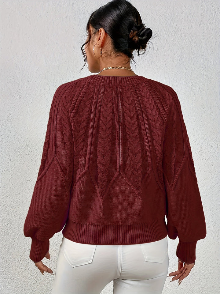 Soft women's cable knit sweater, relaxed fit, wide lantern sleeves. A cozy addition to fall wardrobe.