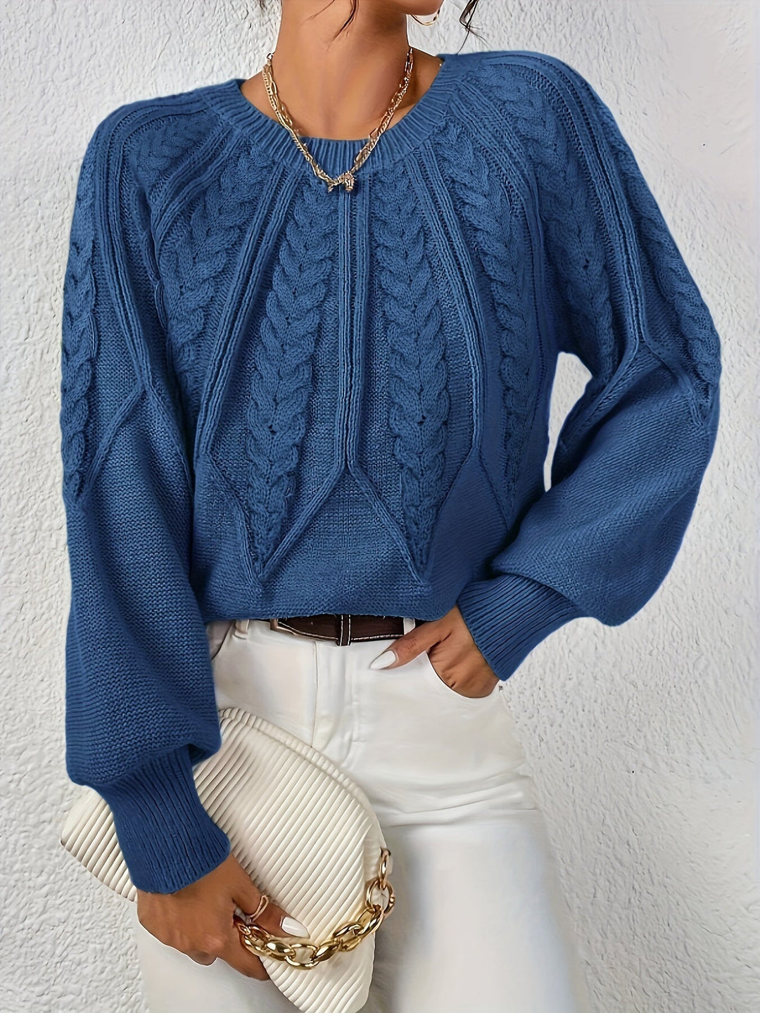 Fashionable women's cable knit sweater, relaxed fit, statement lantern sleeves. Great for layering.