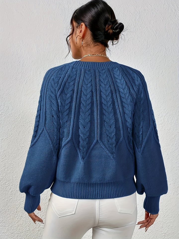 Women's cable knit sweater, relaxed fit, long lantern sleeves. Perfect for an effortlessly chic look.
