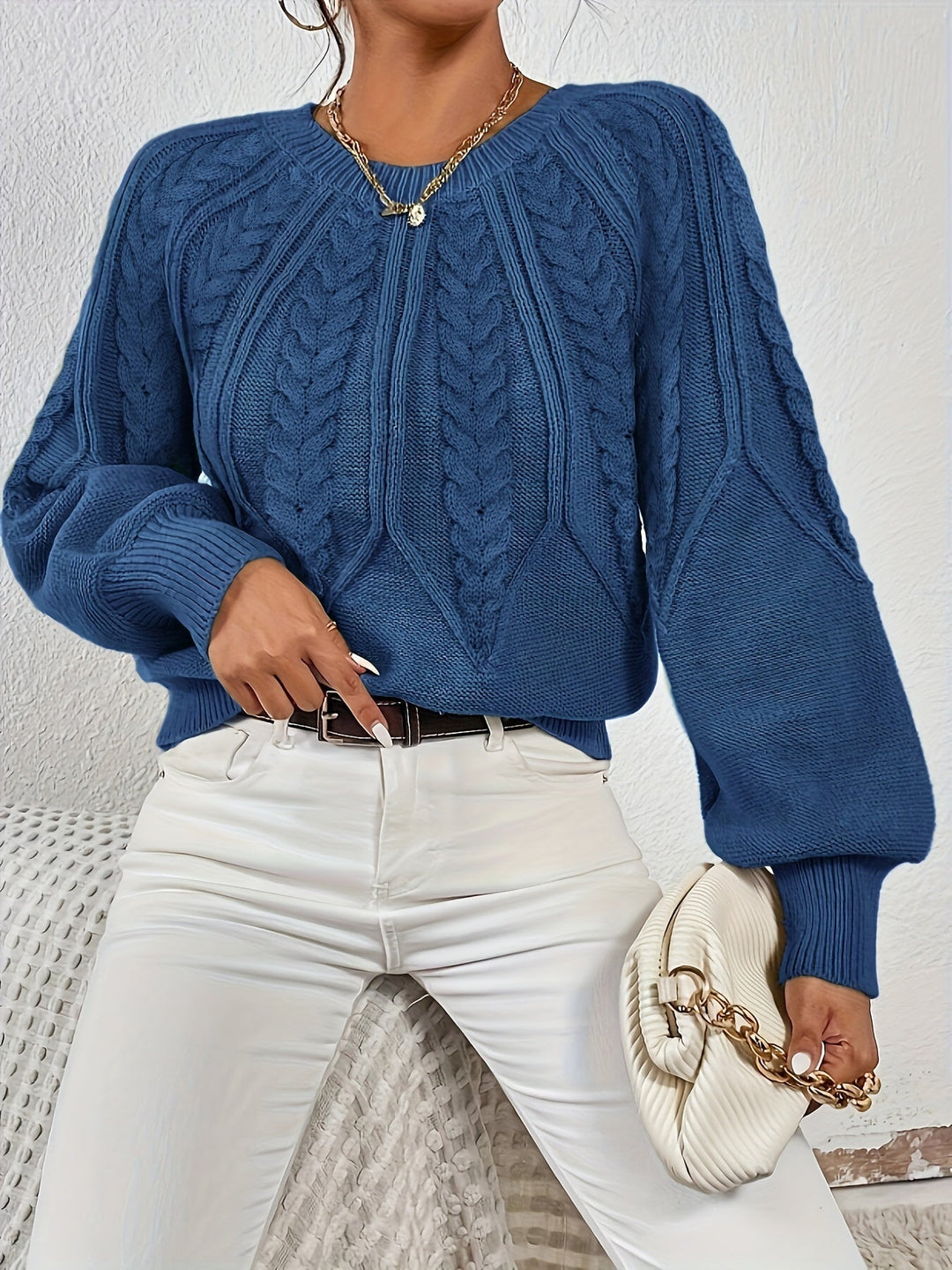 Versatile women's cable knit sweater, relaxed fit, trendy lantern sleeves. Mix and match for fall.