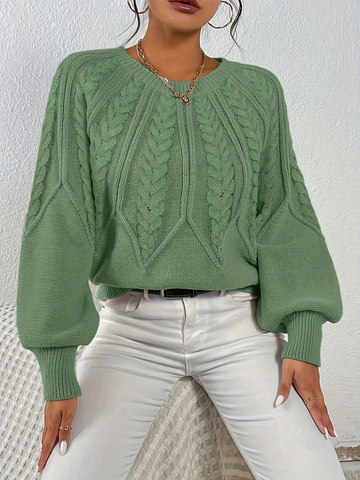 Cozy women's cable knit sweater with elegant lantern sleeves. Relaxed fit, ideal for winter style.