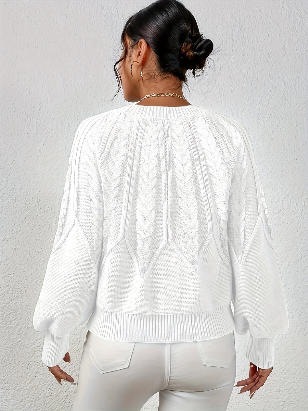 Women's oversized cable knit sweater, relaxed fit, unique lantern sleeves. Trendy and comfortable.