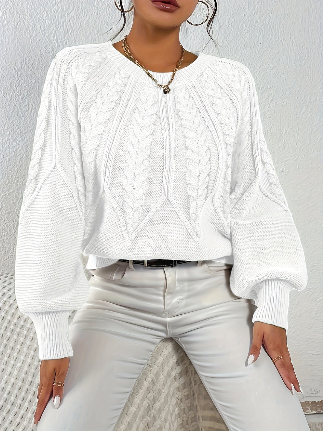 Women's winter fashion cable knit sweater, relaxed fit, chic lantern sleeves. Stay warm & stylish.