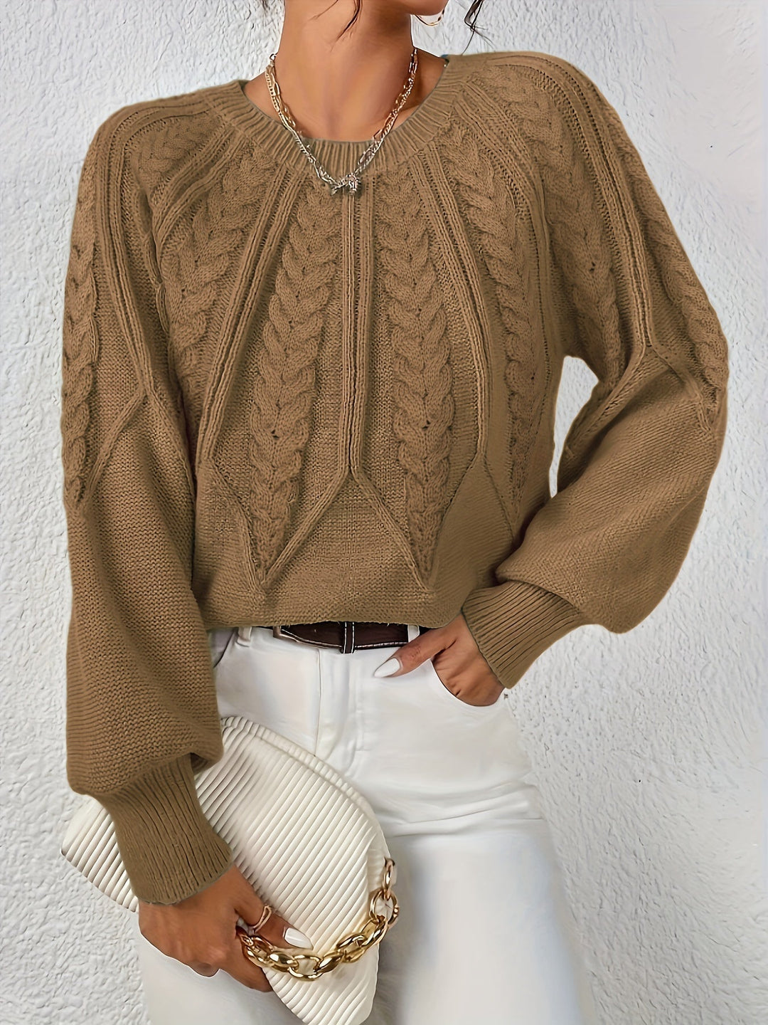 Women's casual chic cable knit sweater, relaxed fit, lantern sleeves. Easy to dress up or down.