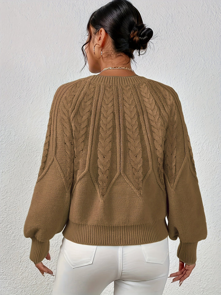 Women's fashion knit cable sweater, relaxed fit, statement lantern sleeves. A stylish wardrobe staple.