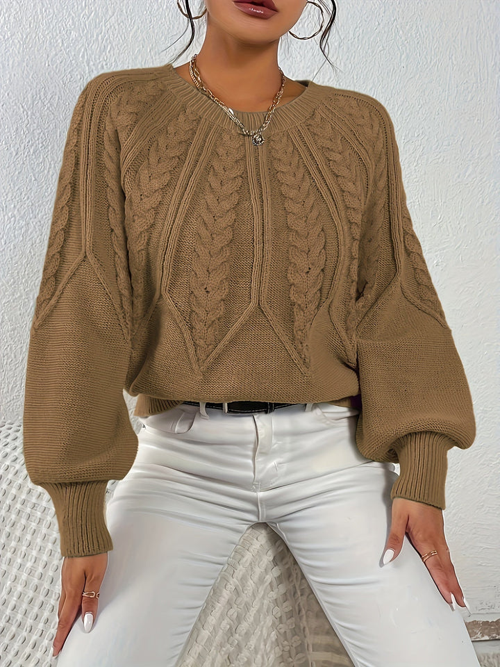 Women's timeless cable knit sweater, relaxed fit, elegant lantern sleeves. Classic winter style.