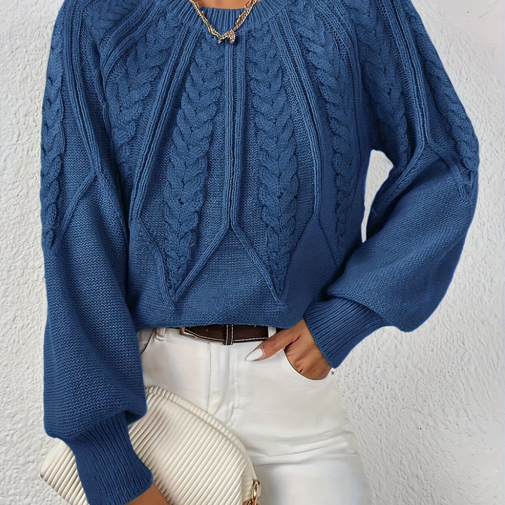 Women's relaxed fit cable knit sweater, featuring beautiful lantern sleeves. Cozy for chilly days.