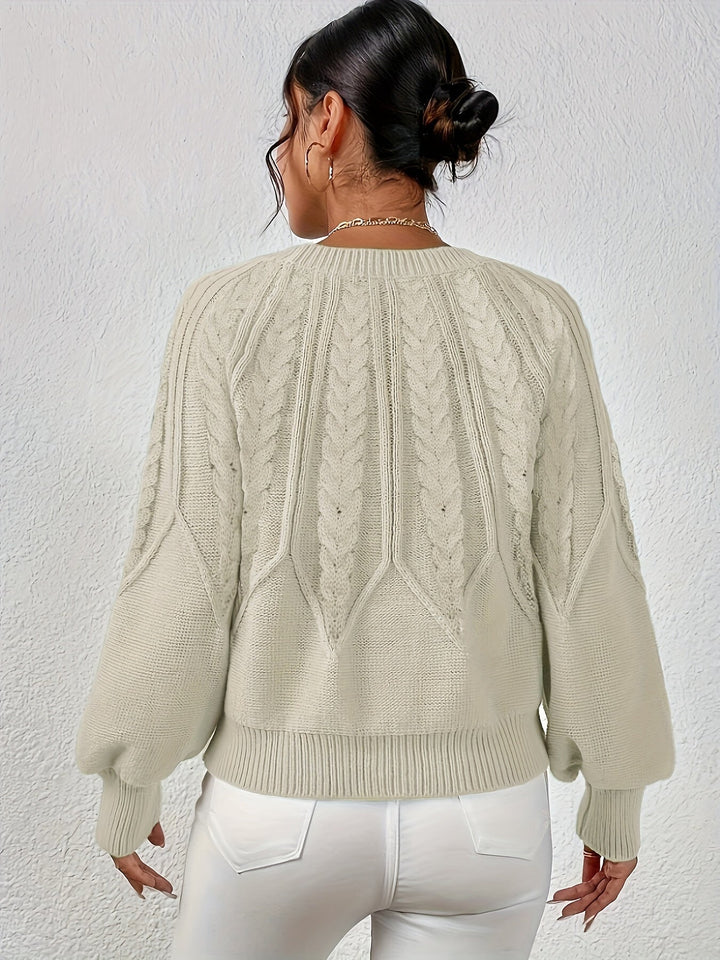 Comfortable women's oversized cable knit sweater with relaxed fit and stylish lantern sleeves.
