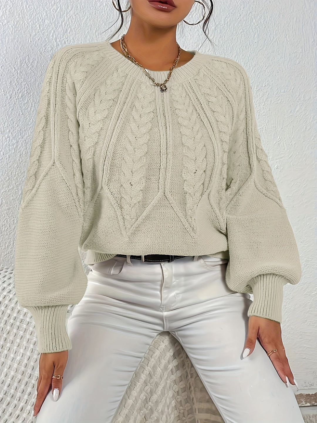 Classic women's cable knit sweater, relaxed fit, lantern sleeves. Versatile for chic fall outfits.