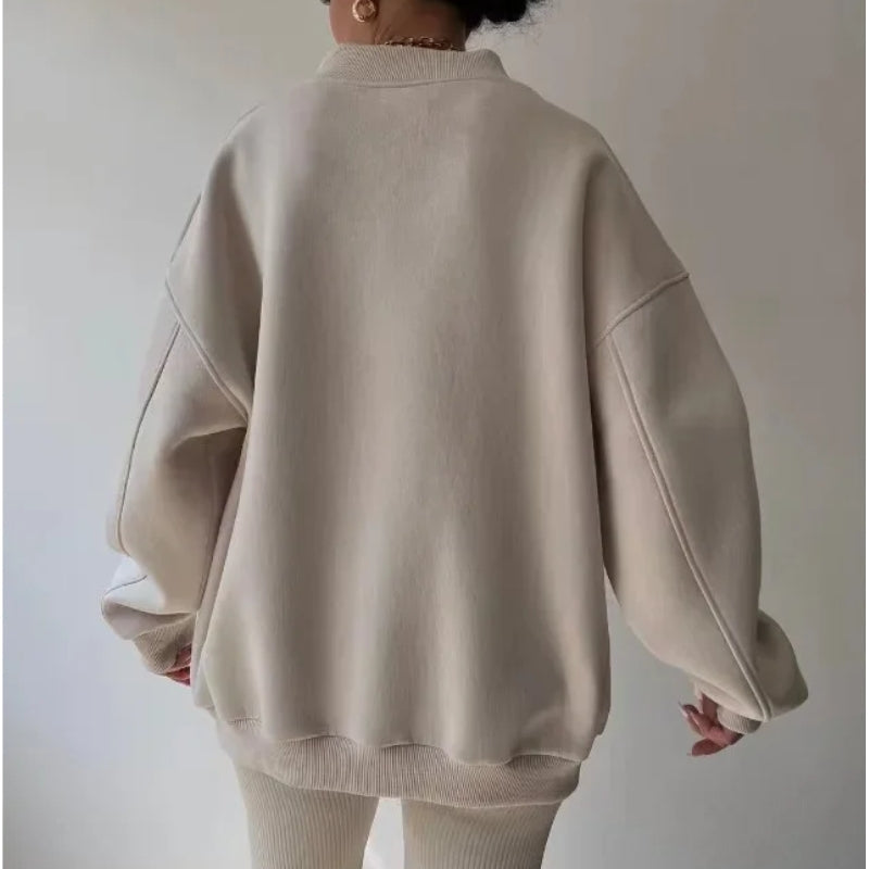 Stylish women's oversized soft knit pullover. Versatile loose fit top for casual fall fashion & winter wear.