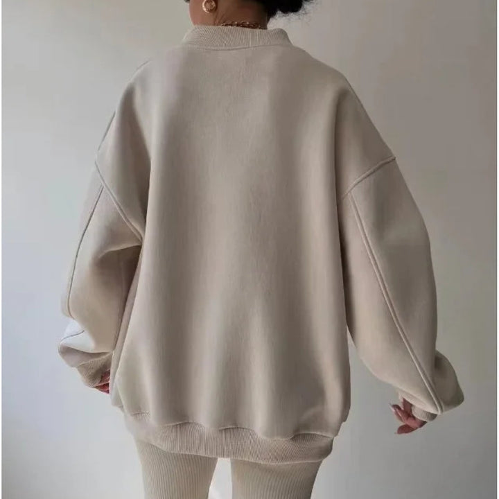 Stylish women's oversized soft knit pullover. Versatile loose fit top for casual fall fashion & winter wear.
