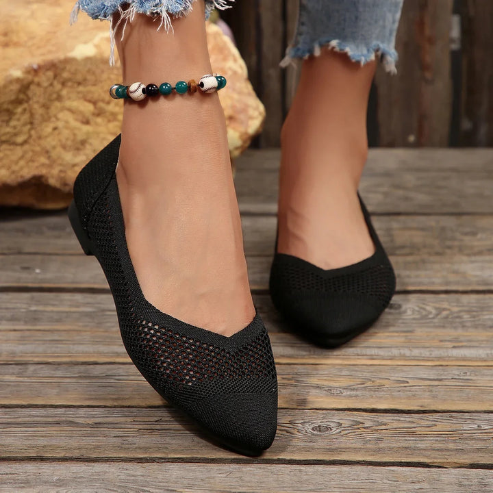 Closeup of women's Calora breathable pointed-toe flats, showing texture and elegant design.