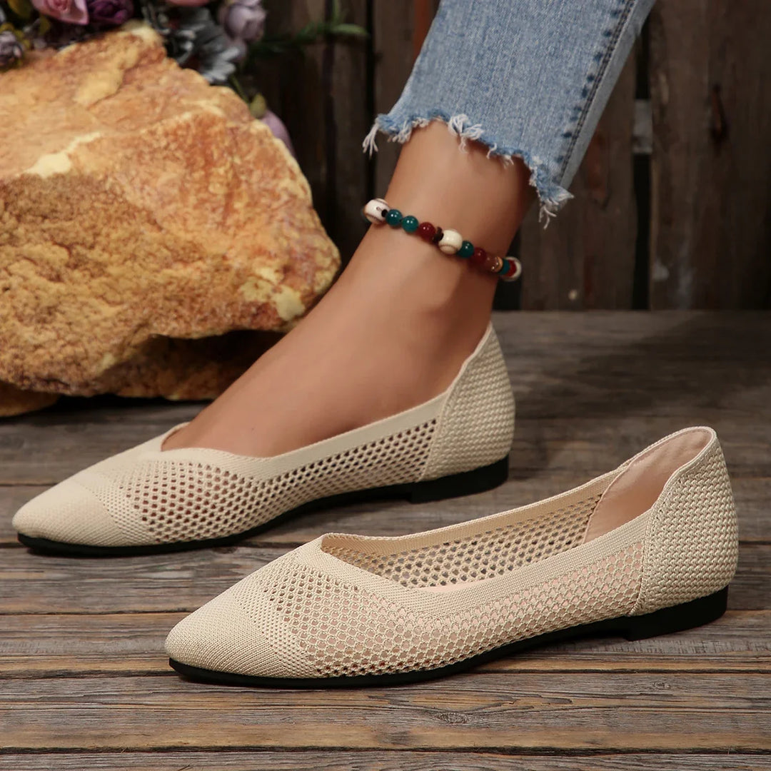 Side view of women's Calora pointed-toe flats, lightweight & breathable for comfort and style.