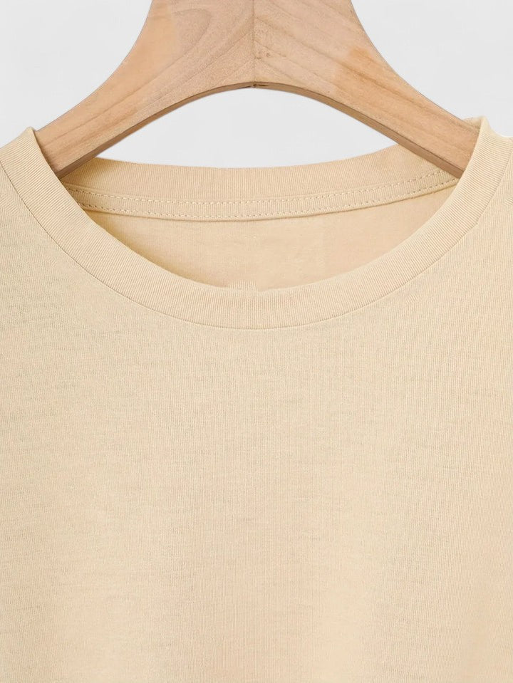 White women's short sleeve t-shirt with a prominent heart graphic, a soft and chic casual top.