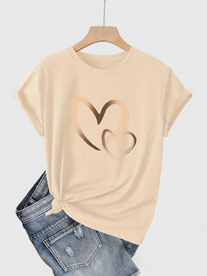 Green women's graphic tee, short sleeve, featuring a sweet heart design. Ideal for relaxed everyday wear.