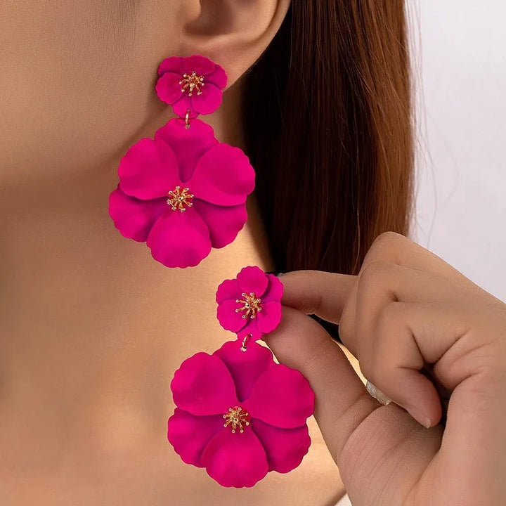 Women's cascading double flower earrings, gold plated, elegant floral statement jewelry accessory.
