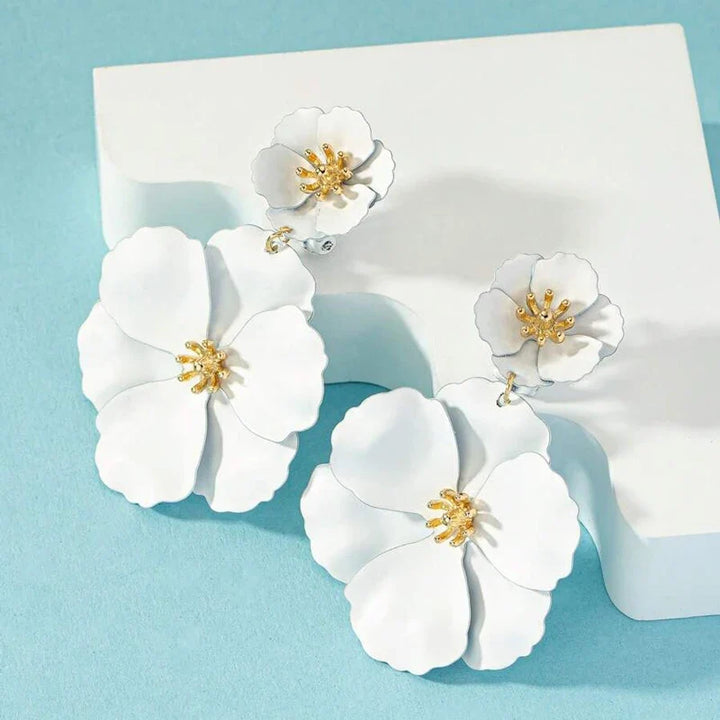 Front view of women's gold plated cascading double flower earrings, exquisite and elegant design.