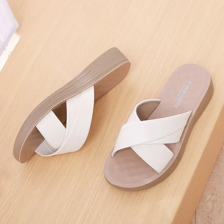 Stylish women's open-toe wedge sandals in tan leatherette, perfect for casual wear