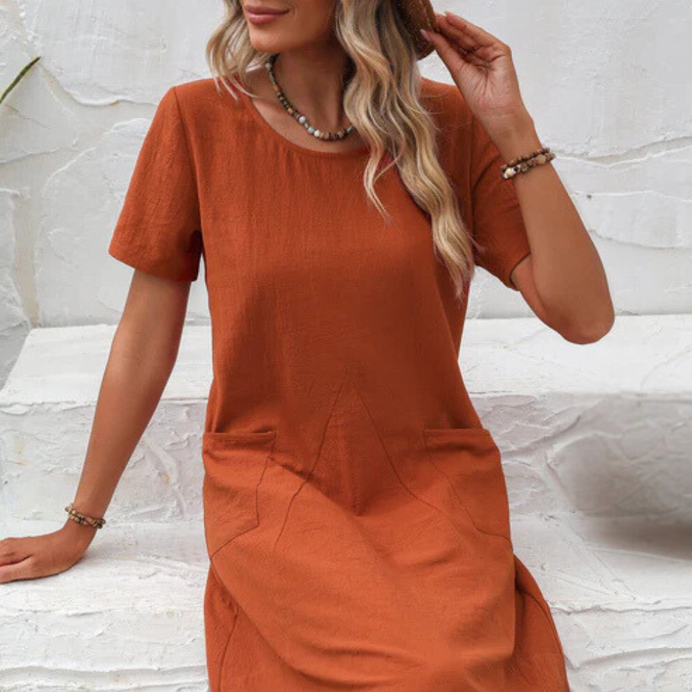 Elegant yet casual flowy summer dress, Mira, for women, providing airy comfort & versatile vacation style.