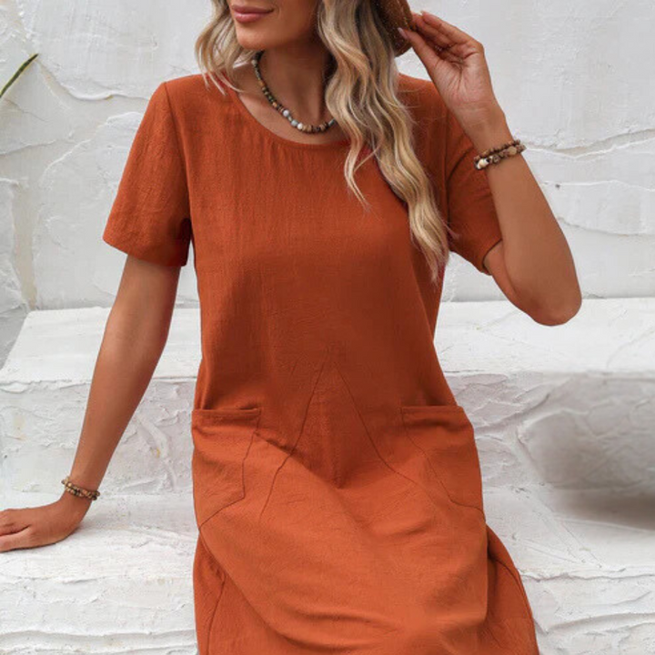 Elegant yet casual flowy summer dress, Mira, for women, providing airy comfort & versatile vacation style.