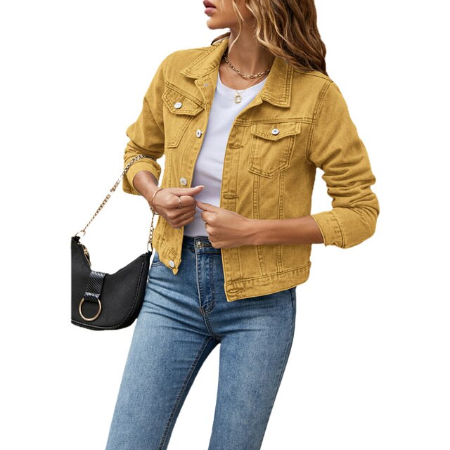 Women's denim jacket open over a top, showcasing versatile layering for trendy spring/fall fashion.