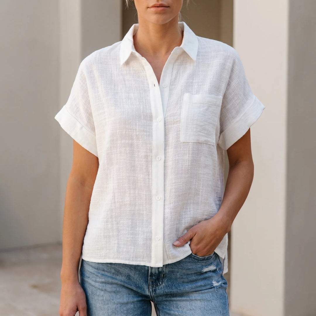 Women's casual button-down shirt with short sleeves, relaxed fit for summer. Versatile everyday comfort top.