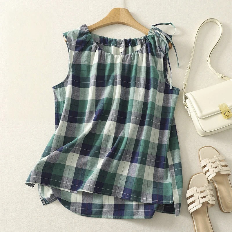 Everyday women's top: checkered print, sleeveless design, and fashionable tie neck. Great for summer.
