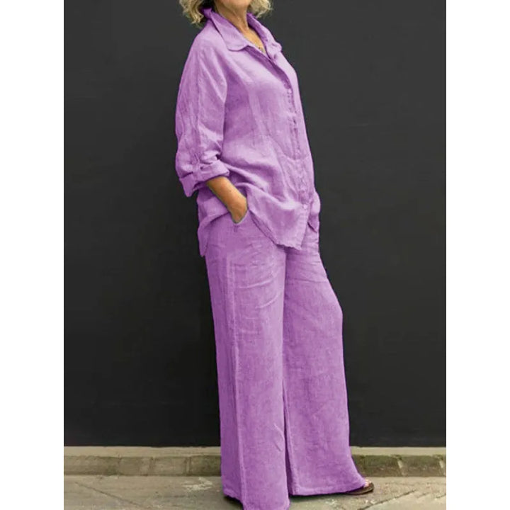 Spring fashion women's set featuring a relaxed button-up shirt and high-waisted wide-leg pants.