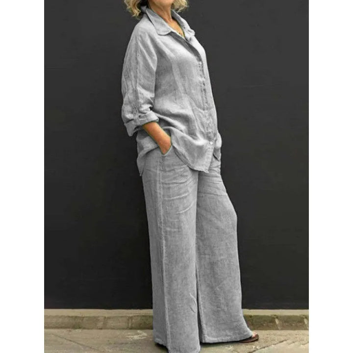 Elegant women's two-piece set for versatile wear. Includes a chic button-up top and wide-leg bottoms.