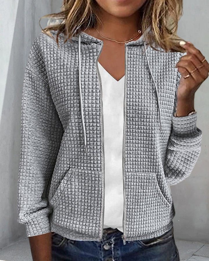 Versatile women's comfort vest, perfect for everyday fashion, with secure zip, cozy feel, and functional pockets.